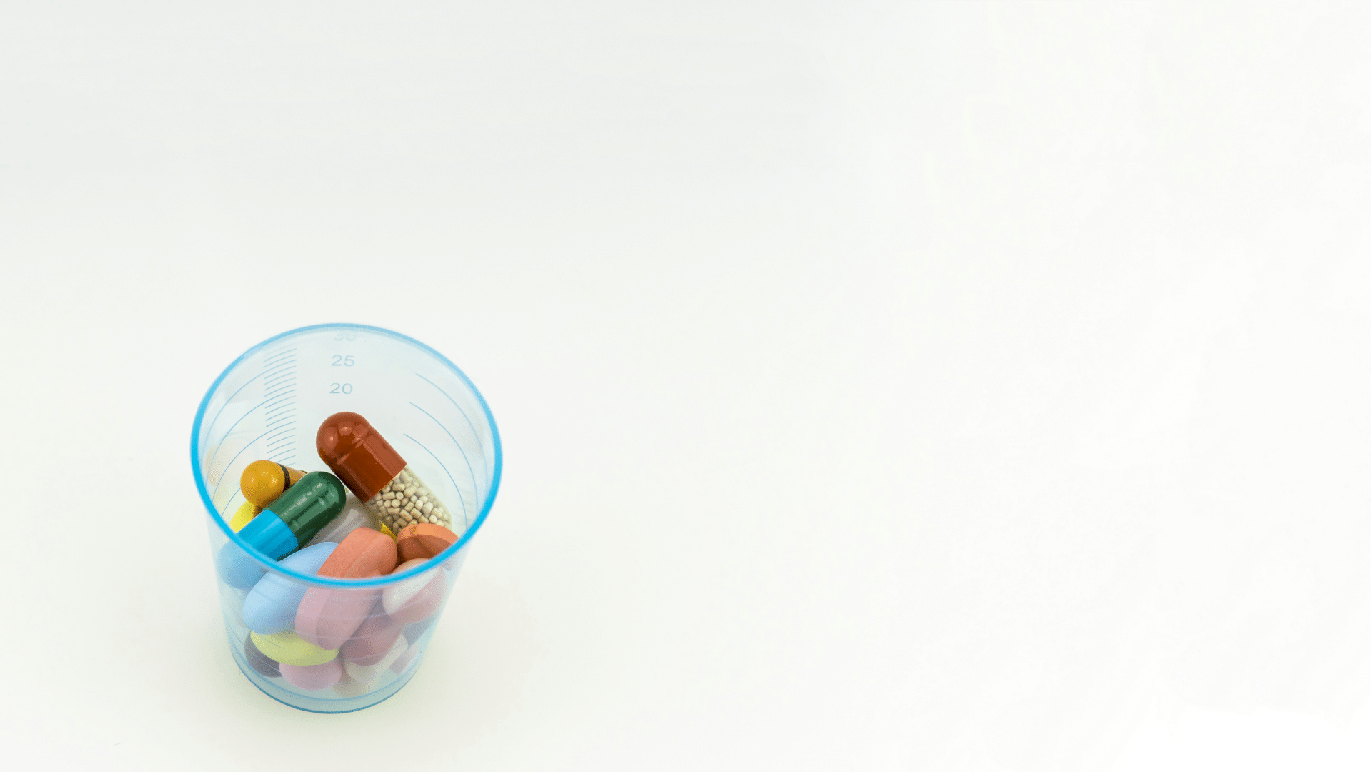 a cup of medical pills